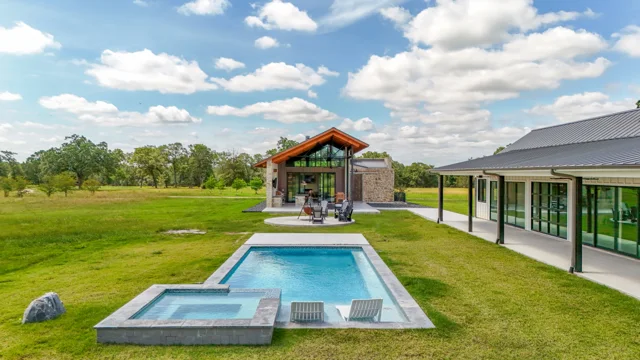 Low elevated view of a swimming pool and covered outdoor area