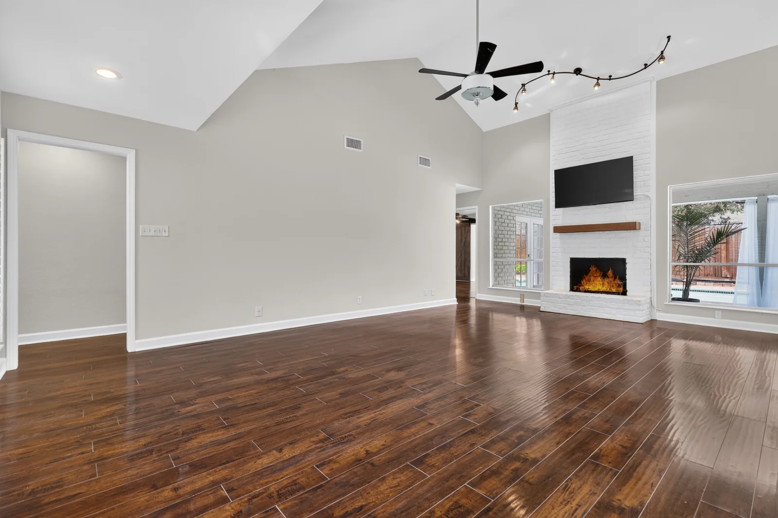 Original empty living room with fireplace