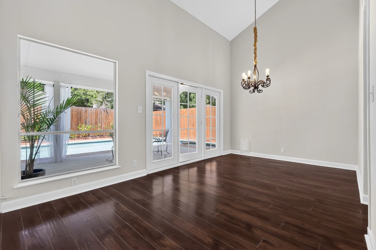 Original empty dining room overlooking the pool