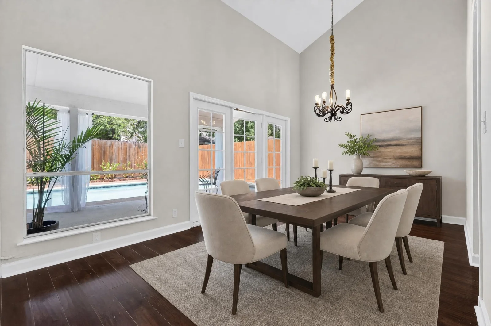Virtually staged dining room overlooking the pool