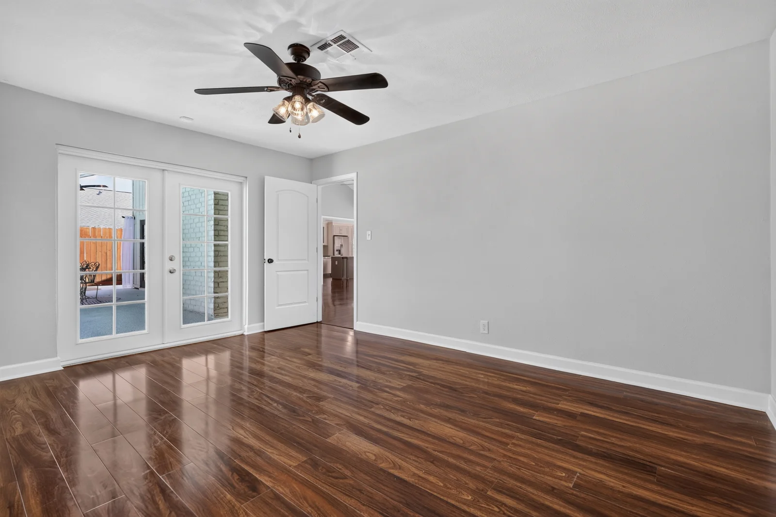 Original empty bedroom with patio doors