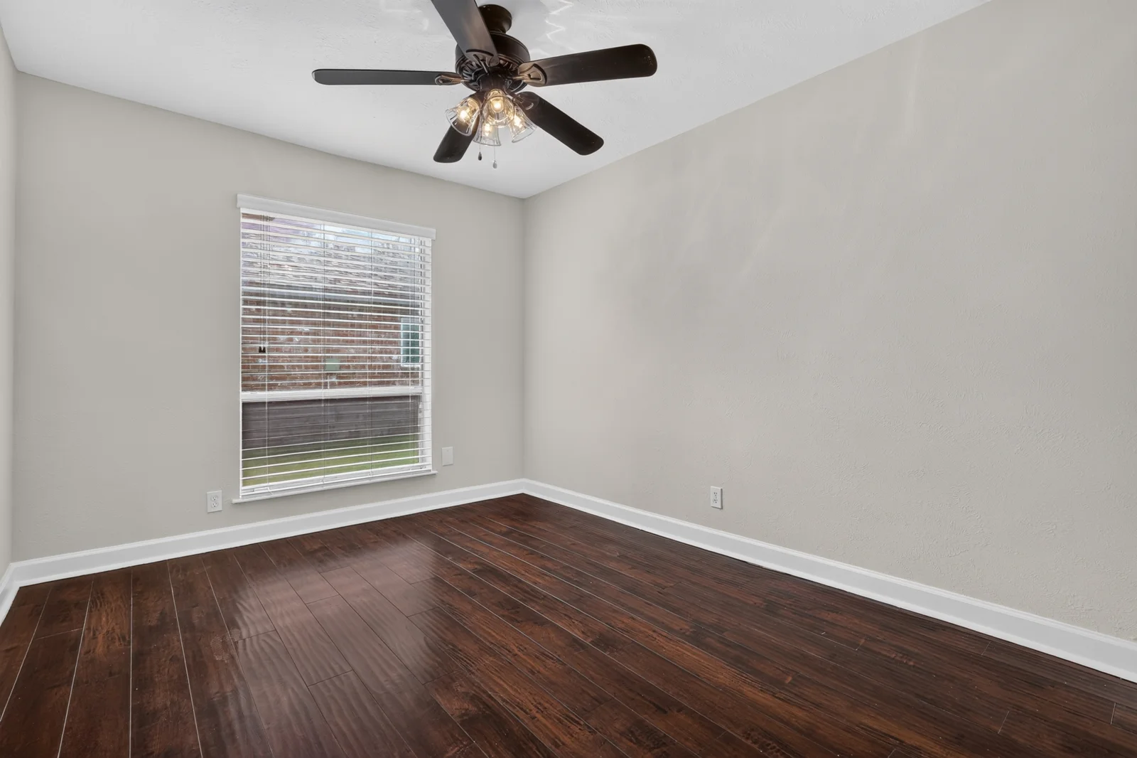Original empty bedroom with a study corner