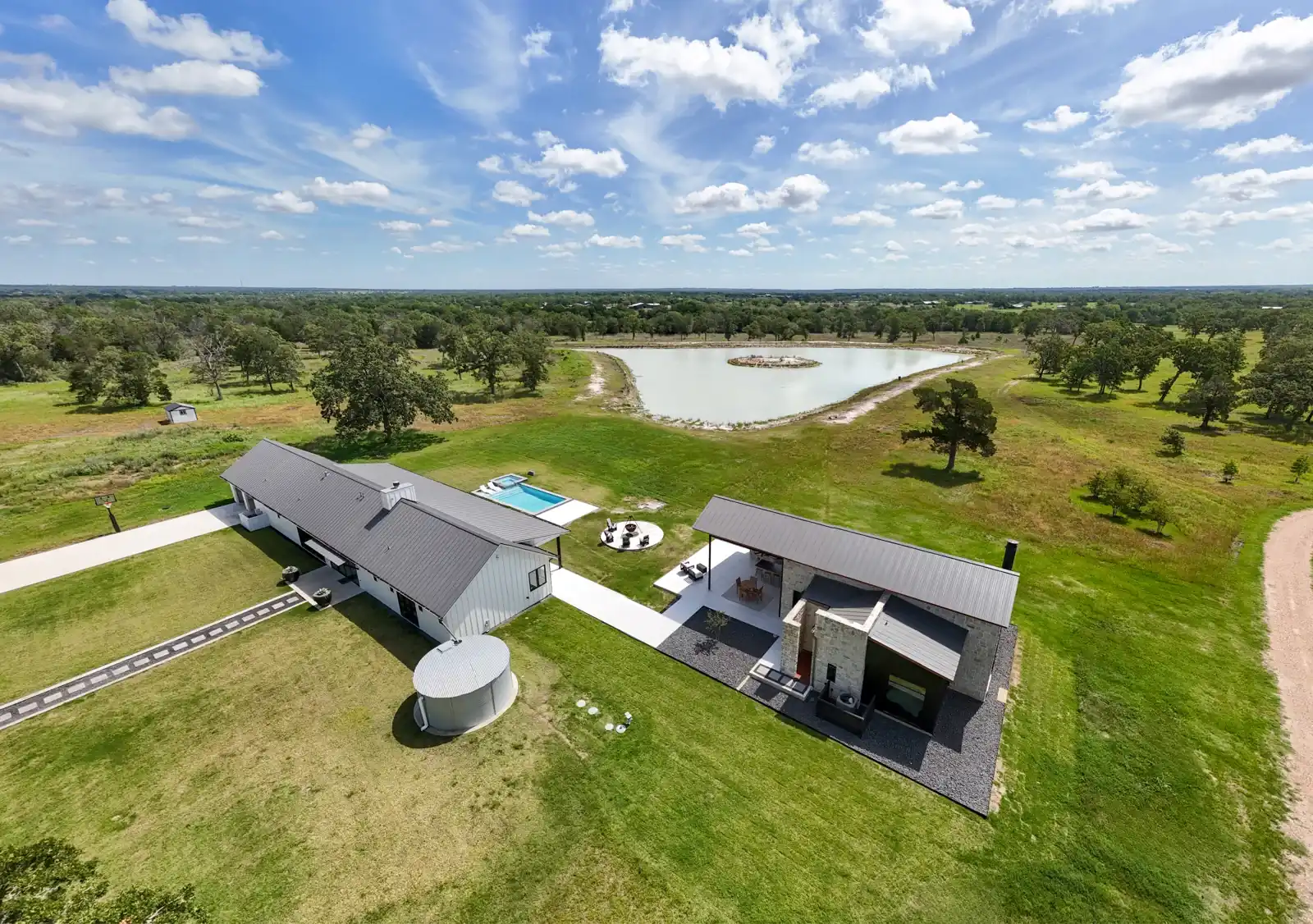 Elevated view of a home, pool and outdoor living space