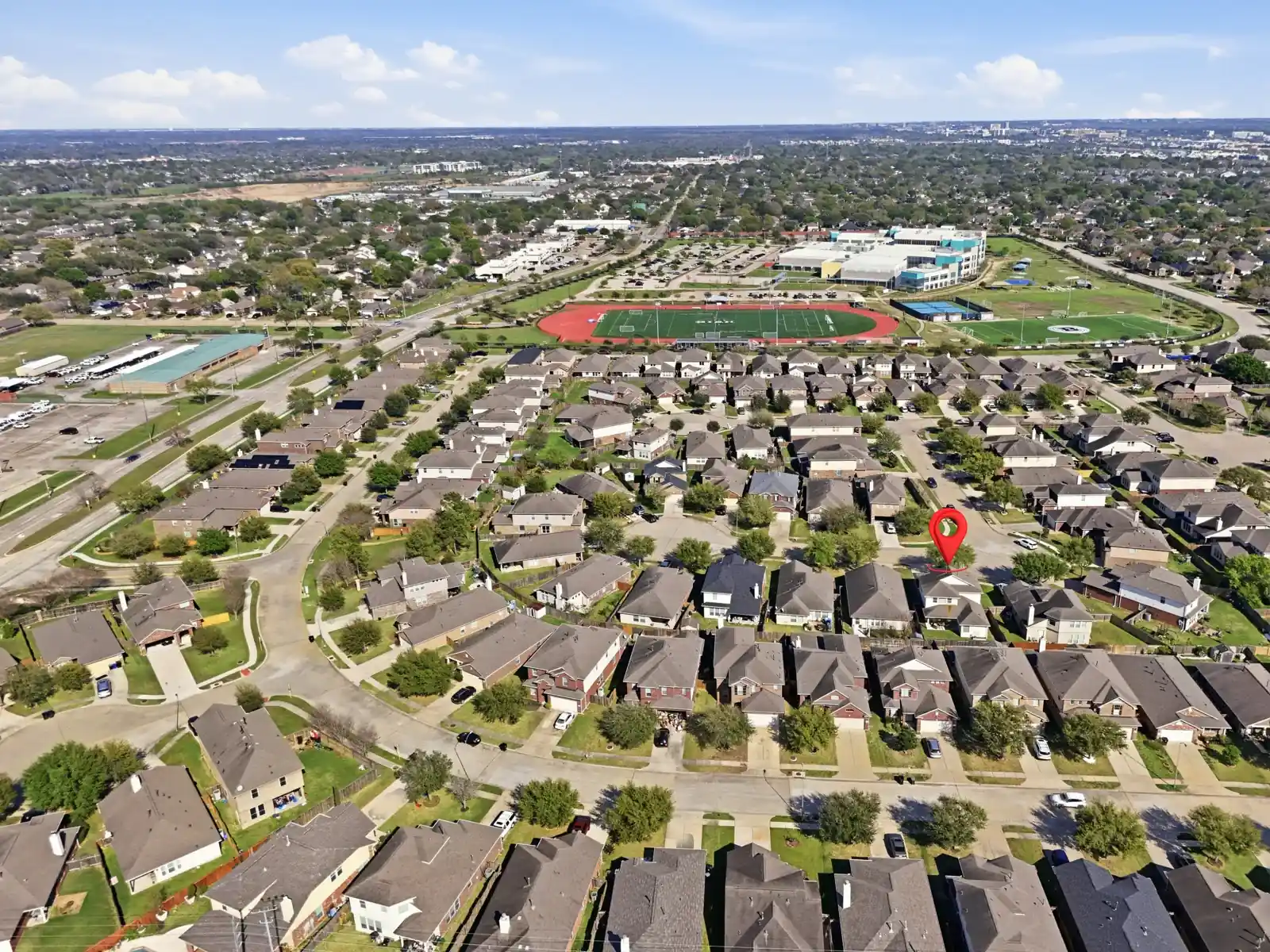 Wide view of a neighbourhood with a marked property location