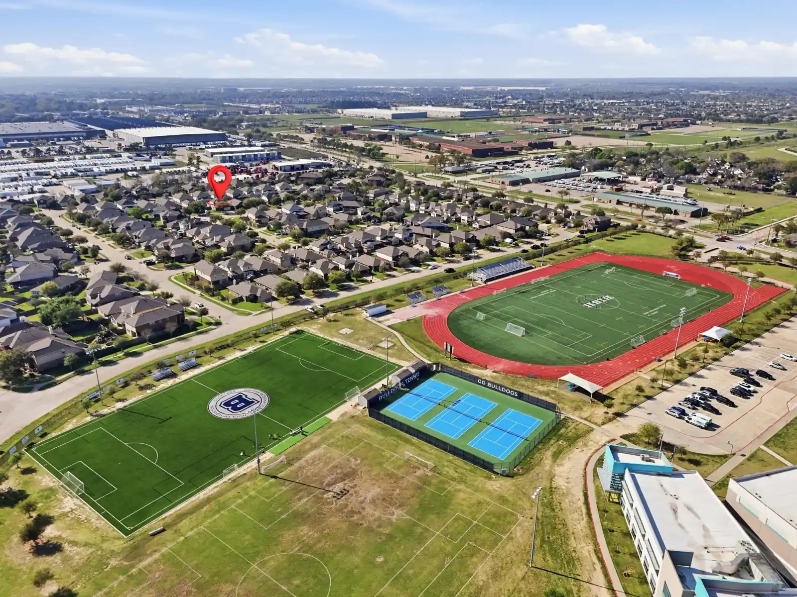 Aerial view showing residential streets and nearby sports facilities