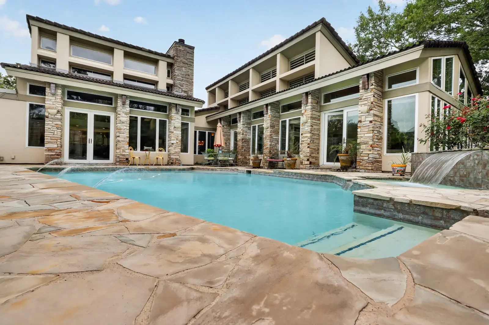 Pool and rear elevation, daytime