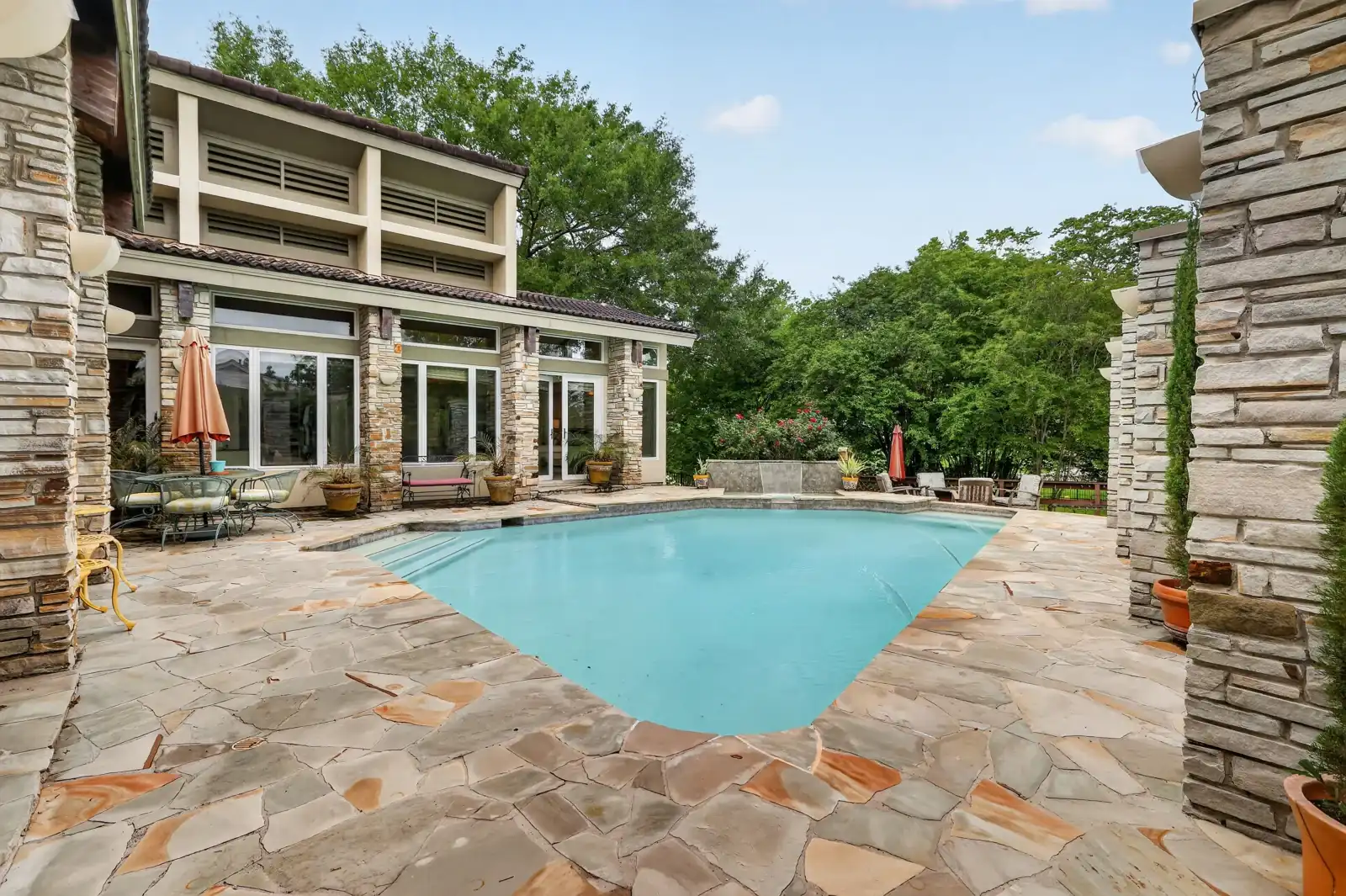 Pool viewed from the covered patio, daytime
