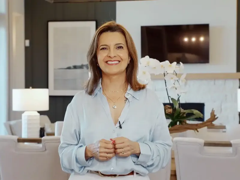 Real estate agent presenting on camera inside a home