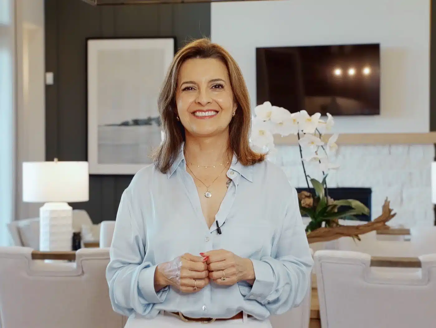 Real estate agent presenting on camera inside a home
